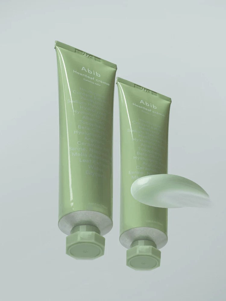 Two Abib Heartleaf Crème Calming Tubes with texture displayed in front, showcasing their soft sherbet consistency.