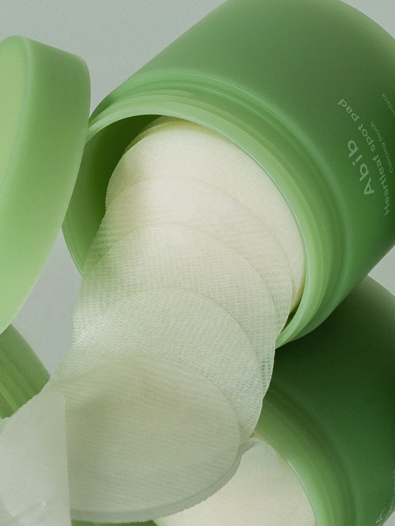 Abib Heartleaf Spot Pad Calming Touch with pads coming out, showcasing its convenient format.