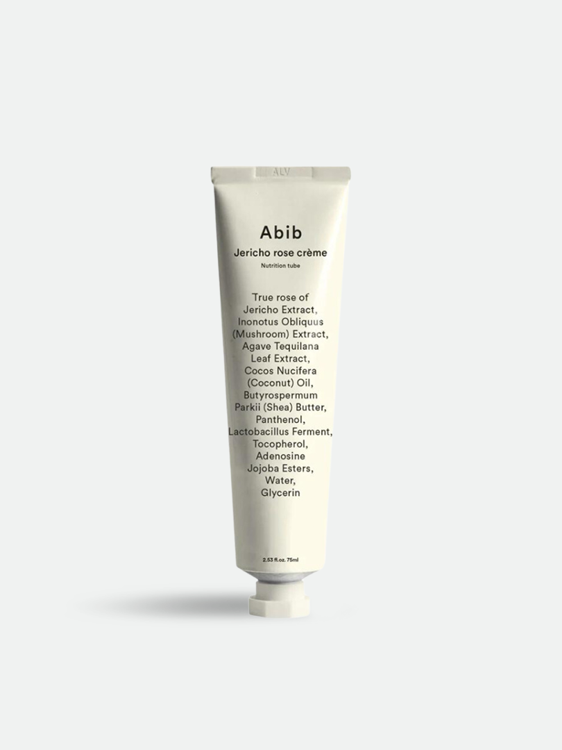 A white tube of Abib Jericho Rose Crème, showcasing ingredient details and minimalist branding, displayed against a light gray background.