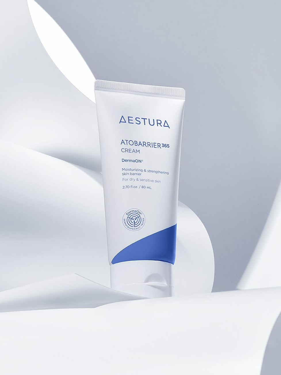 A tube of Aestura Atobarrier 365 Cream, designed to moisturize and strengthen dry, sensitive skin, set against a soft white background.