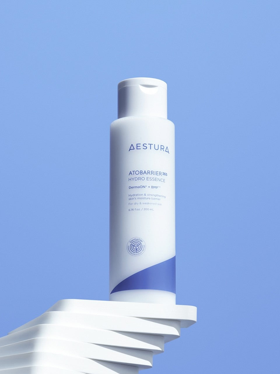 Aestura Atobarrier 365 Hydro Essence bottle promoting hydration for dry and weakened skin, displayed against a clear blue background.