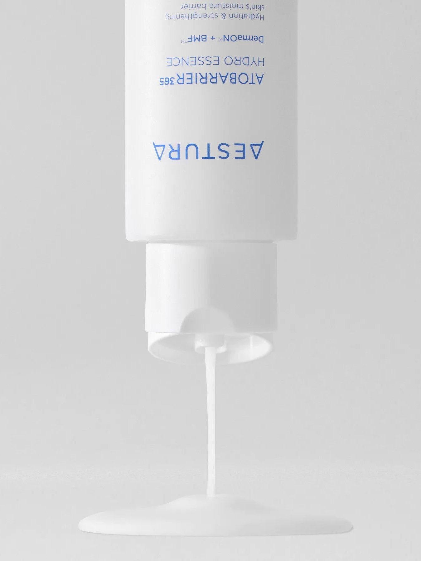 Aestura Atobarrier 365 Hydro Essence dispensing its creamy yet lightweight liquid onto a smooth surface.