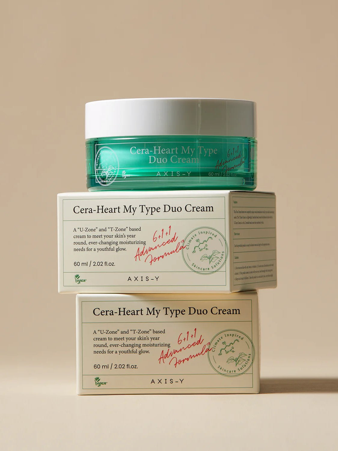 Jar of AXIS-Y Cera-Heart My Type Duo Cream atop two boxes, highlighting moisturizing benefits for diverse skin types.