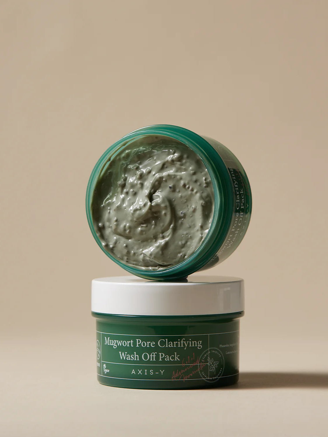 Two jars of Mugwort Pore Clarifying Wash Off Pack by AXIS-Y stacked, showcasing creamy green product inside the top jar.