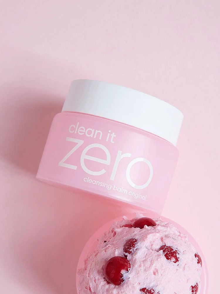 Banila Co Clean It Zero Cleansing Balm Original placed next to a scoop of acerola berry ice cream on a pink background, referencing its key ingredient Acerola Berry.