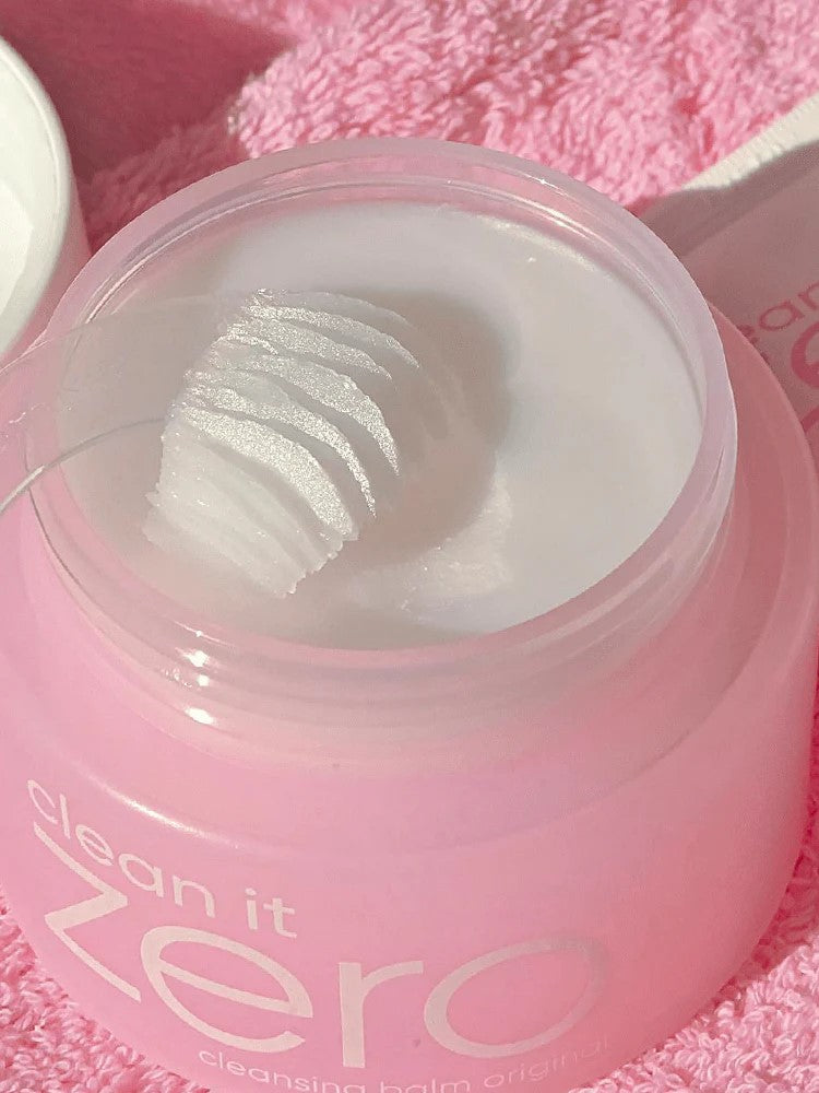 Close-up of Banila Co Clean It Zero Cleansing Balm Original jar with a textured scoop of balm inside, showing its smooth consistency.