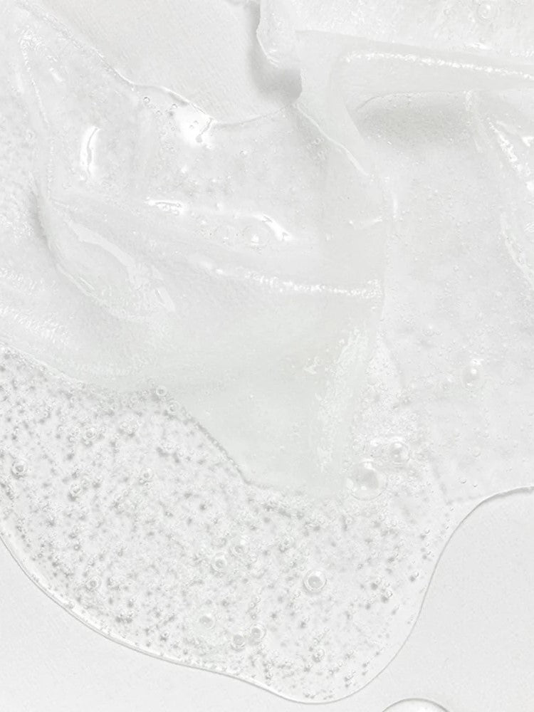 Close-up of the Beauty of Joseon Centella Asiatica Calming Mask sheet, highlighting its essence-like texture with visible translucency and moisture.