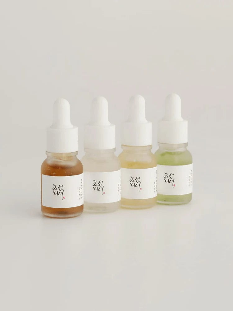 Mini size of the four Beauty of Joseon serums placed together on a neutral background, showcasing the complete collection.