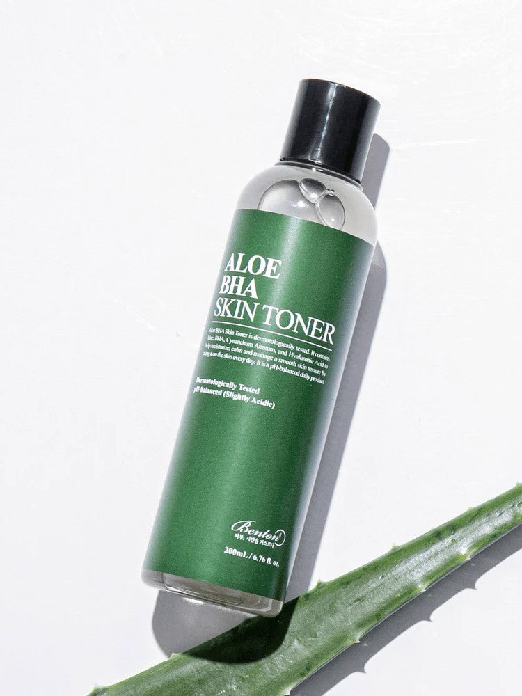 Benton Aloe BHA Skin Toner bottle with a green label on a white background, highlighting its soothing and skin-balancing properties.