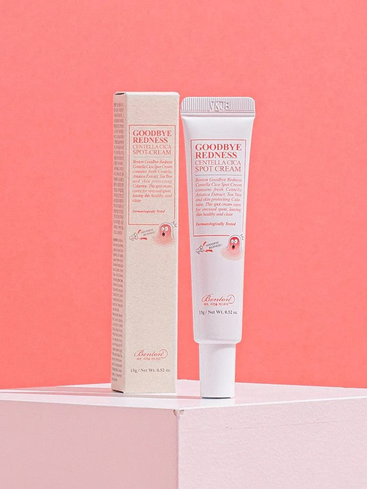 Benton Goodbye Redness Centella Spot Cream tube with packaging on a pastel pink background, emphasizing soothing skincare for sensitive, stressed skin.