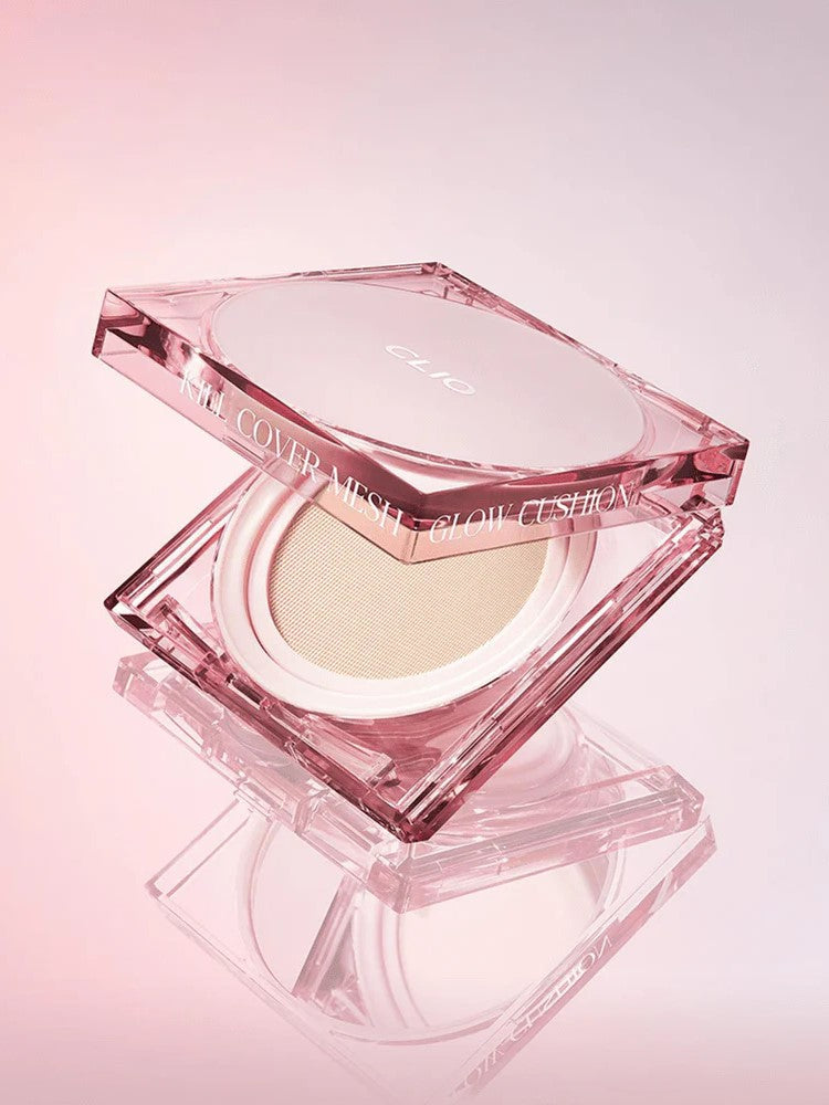 Pink hexagonal compact of CLIO Kill Cover Mesh Glow Cushion, partially open to reveal the cushion inside, on a soft gradient background.