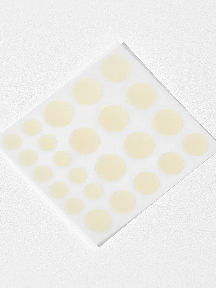 Cosrx Acne Pimple Master Patches in various sizes, arranged on a transparent backing, set against a white background.