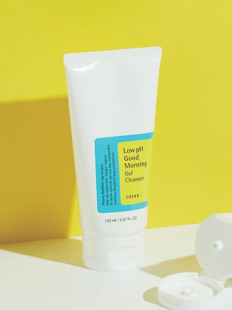 A tube of Cosrx Low pH Good Morning Gel Cleanser against a bright yellow background, emphasizing its fresh and clean design.