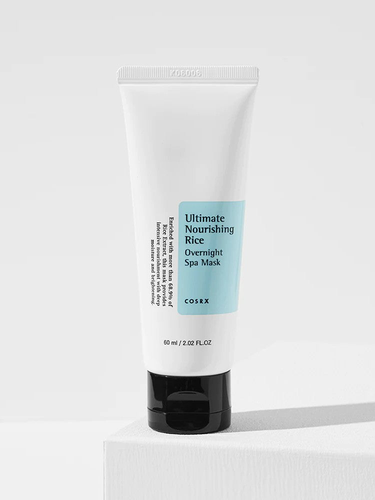 Cosrx Ultimate Nourishing Rice Overnight Spa Mask with blue label, standing on a light background.
