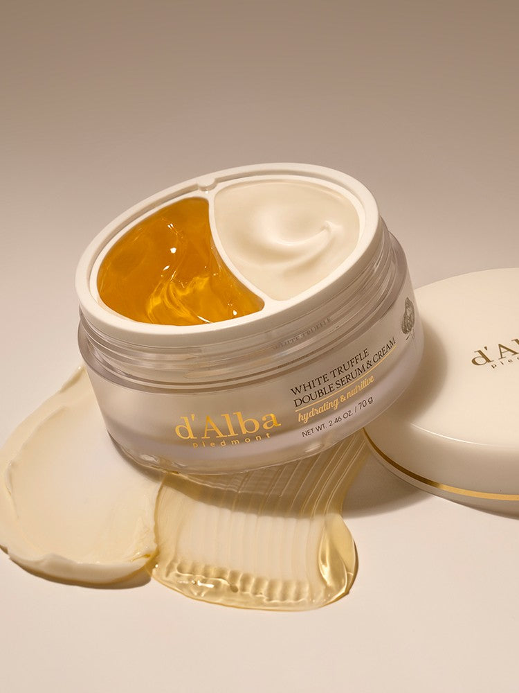 A jar of d'Alba White Truffle Double Serum & Cream, showcasing its gold jelly and white cream formula designed to hydrate and nourish the skin.