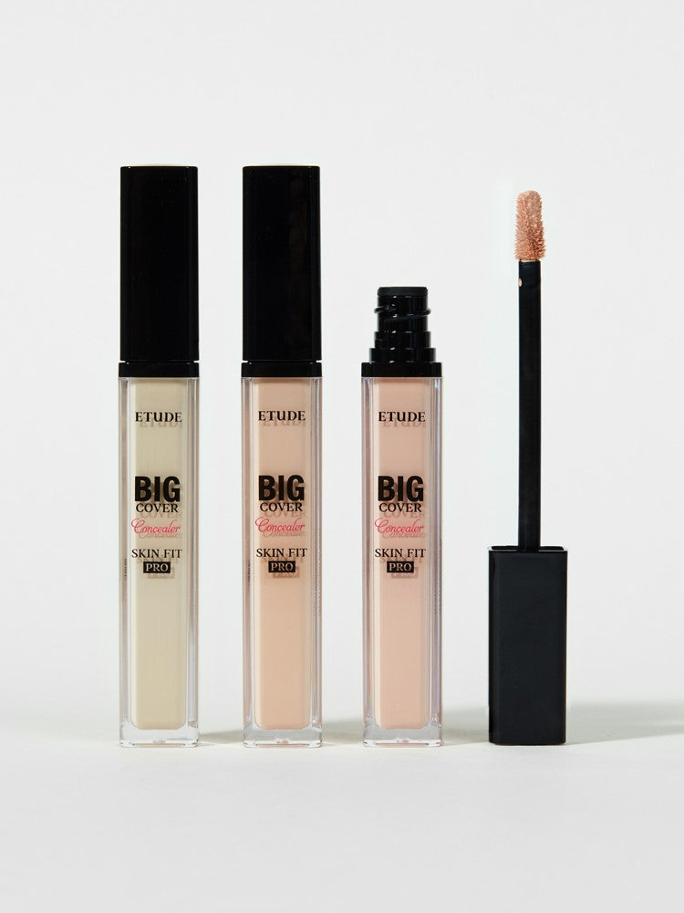 Three Etude Big Cover Skin Fit Pro concealers in varying shades, with an applicator wand displayed alongside.