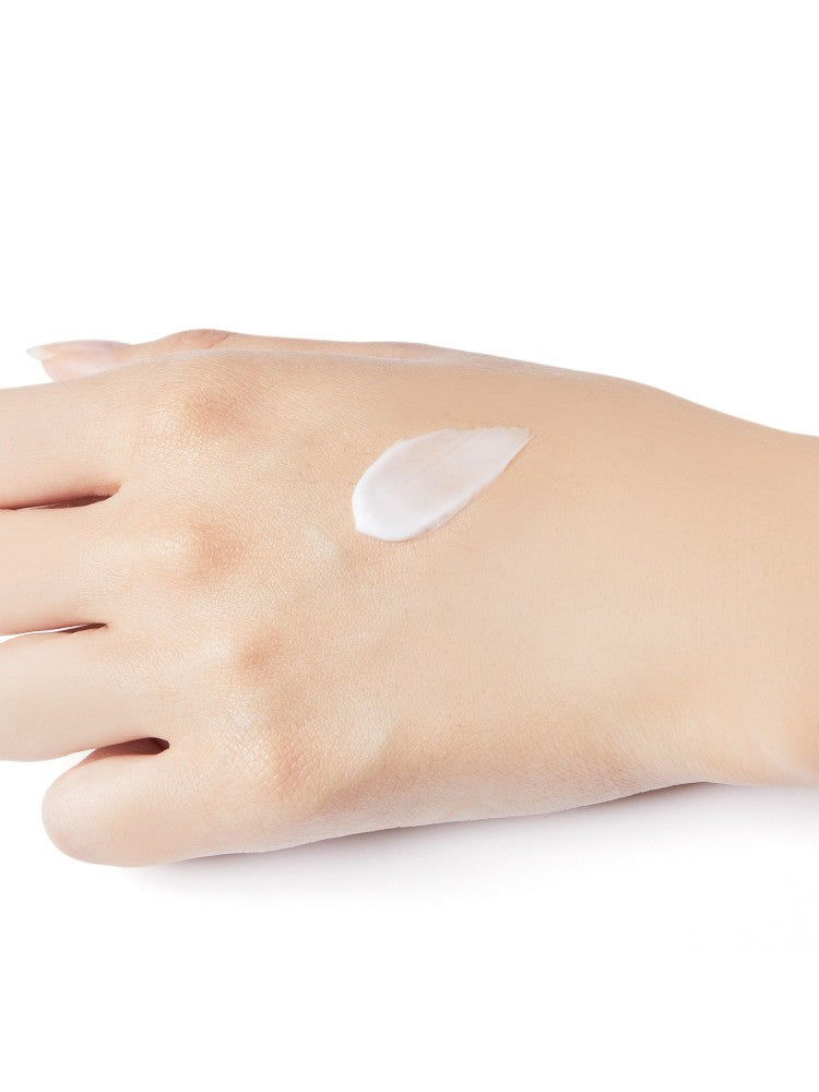 A pale hand on a white background with a dollop of Etude House Moistfull Collagen Eye Cream on the palm, showcasing its smooth texture.