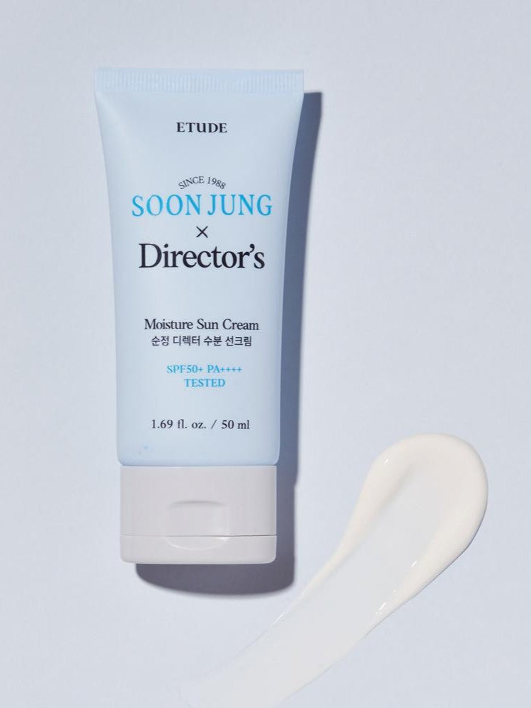 A tube of Etude House Soon Jung x Director's Moisture Sun Cream SPF 50+ placed beside a smooth white cream swatch on a light background.