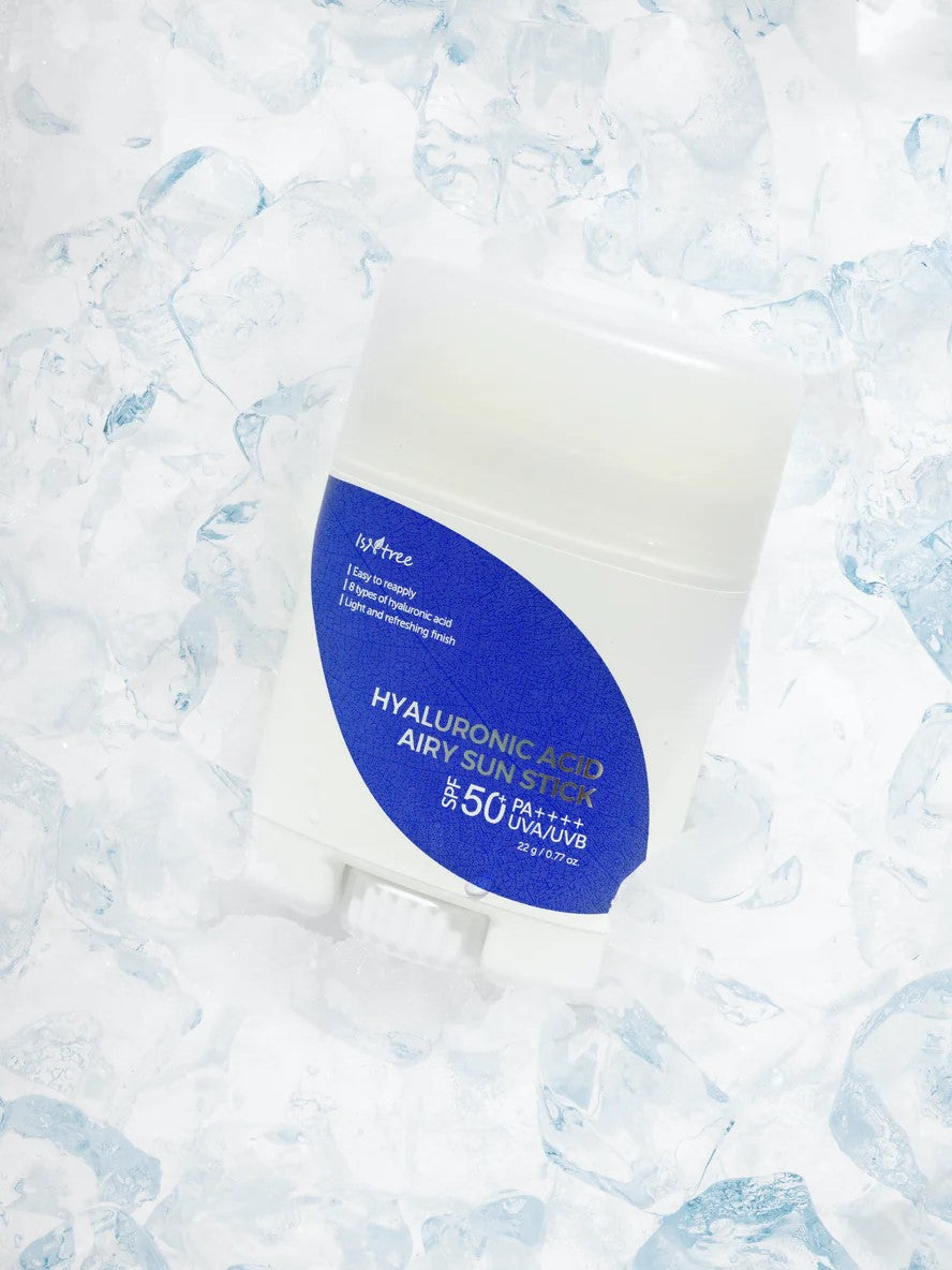 Isntree Hyaluronic Acid Airy Sun Stick SPF 50 placed on a bed of ice cubes, emphasizing its refreshing and cooling feel.