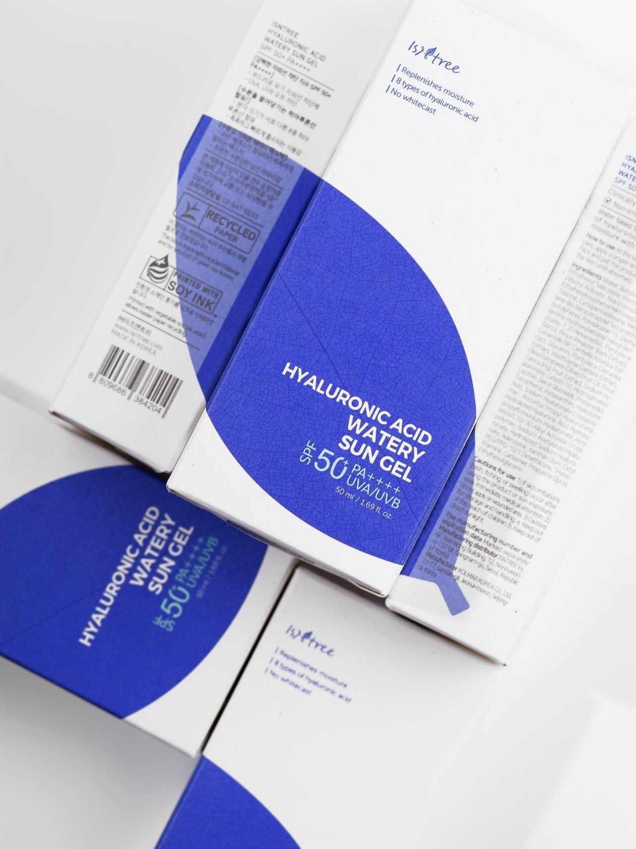 Close-up of the ISNTREE Hyaluronic Acid Watery Sun Gel packaging with a blue and white design, labeled SPF 50 for sun protection.