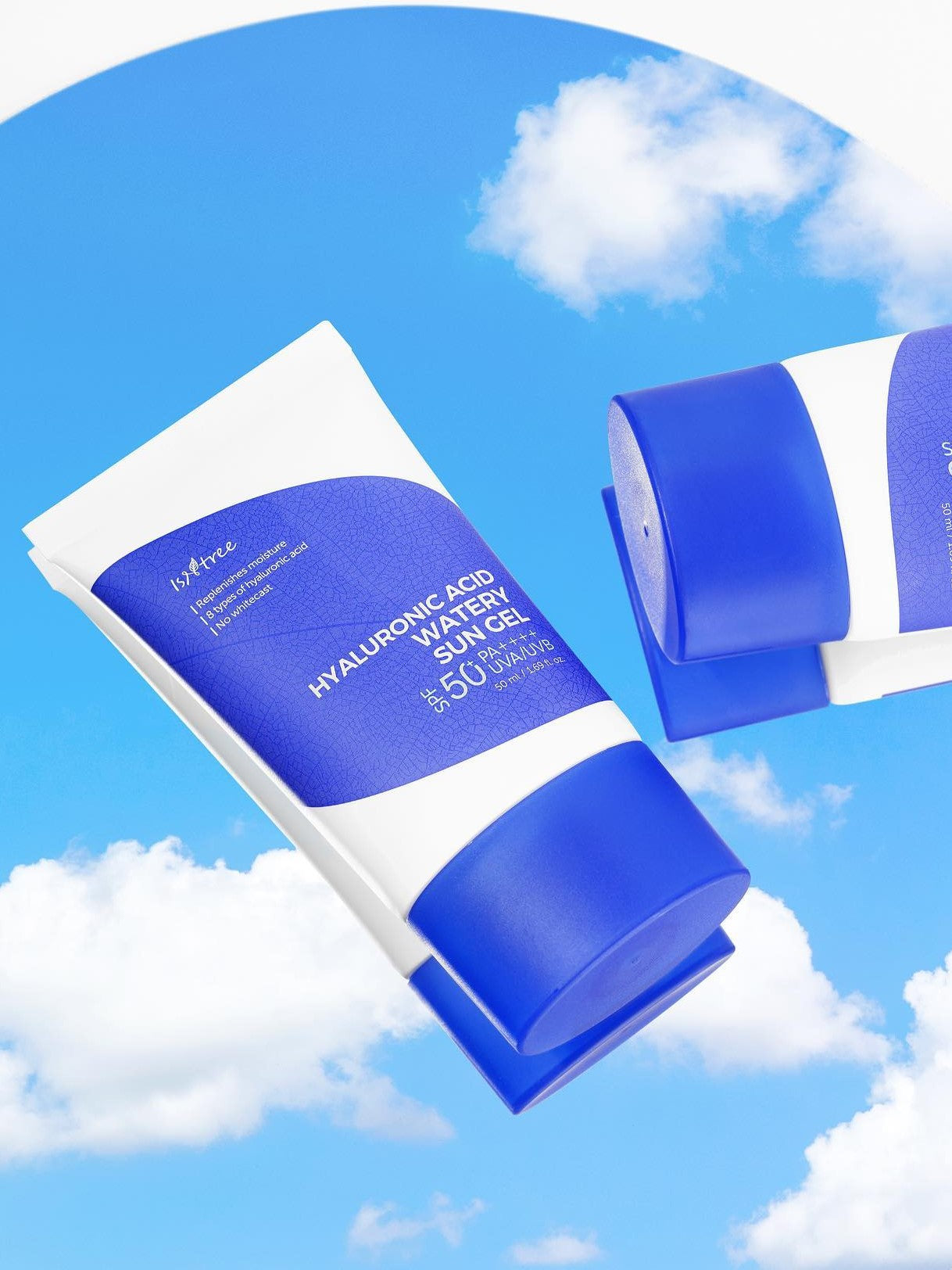 Two tubes of Isntree Hyaluronic Acid Watery Sun Gel against a bright blue sky with clouds, highlighting their vibrant packaging.