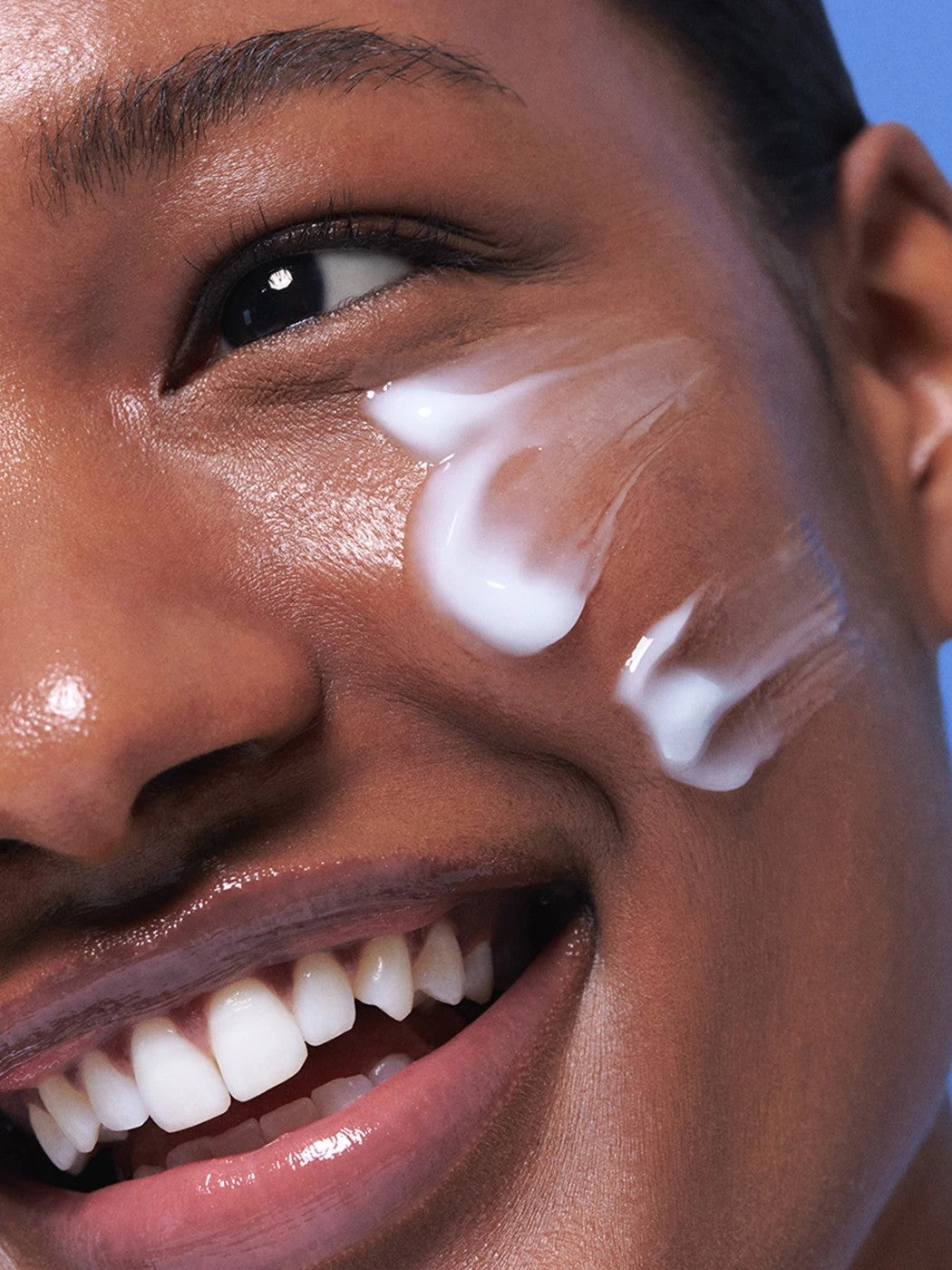 Close-up of a model’s cheek showcasing the lightweight gel texture of the Laneige Water Sleeping Mask, highlighting its smooth application and hydrating benefits.
