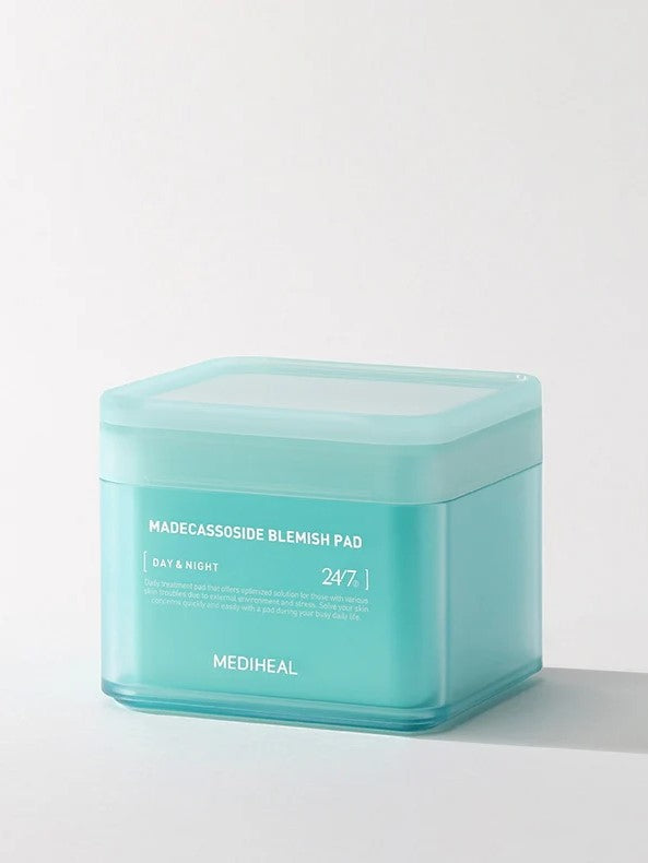 Teal container of Mediheal Madecassoside Blemish Pad, labeled for day and night use, specially formulated for blemish treatment.