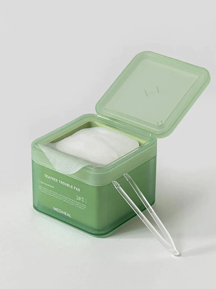Open green box of Mediheal Teatree Trouble Pad, revealing a white cotton pad with tweezers for easy application.