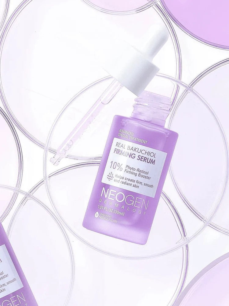 Close-up of Neogen's Real Bakuchiol Firming Serum in a purple bottle, artistically surrounded by circular translucent discs, emphasizing its innovative and firming formula.