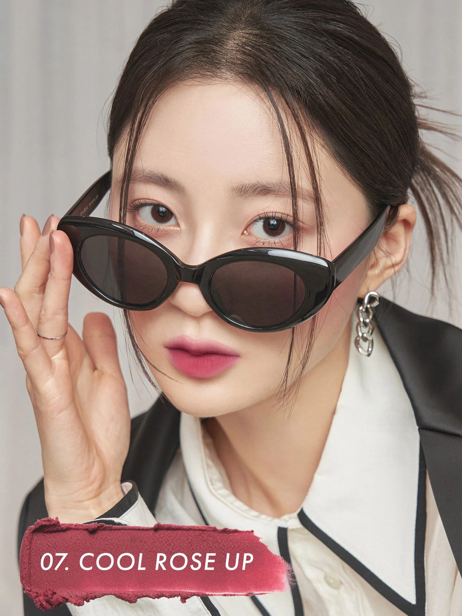 A model wearing Romand Blur Fudge Tint in the shade Cool Rose Up, showcasing the soft matte texture on her lips.