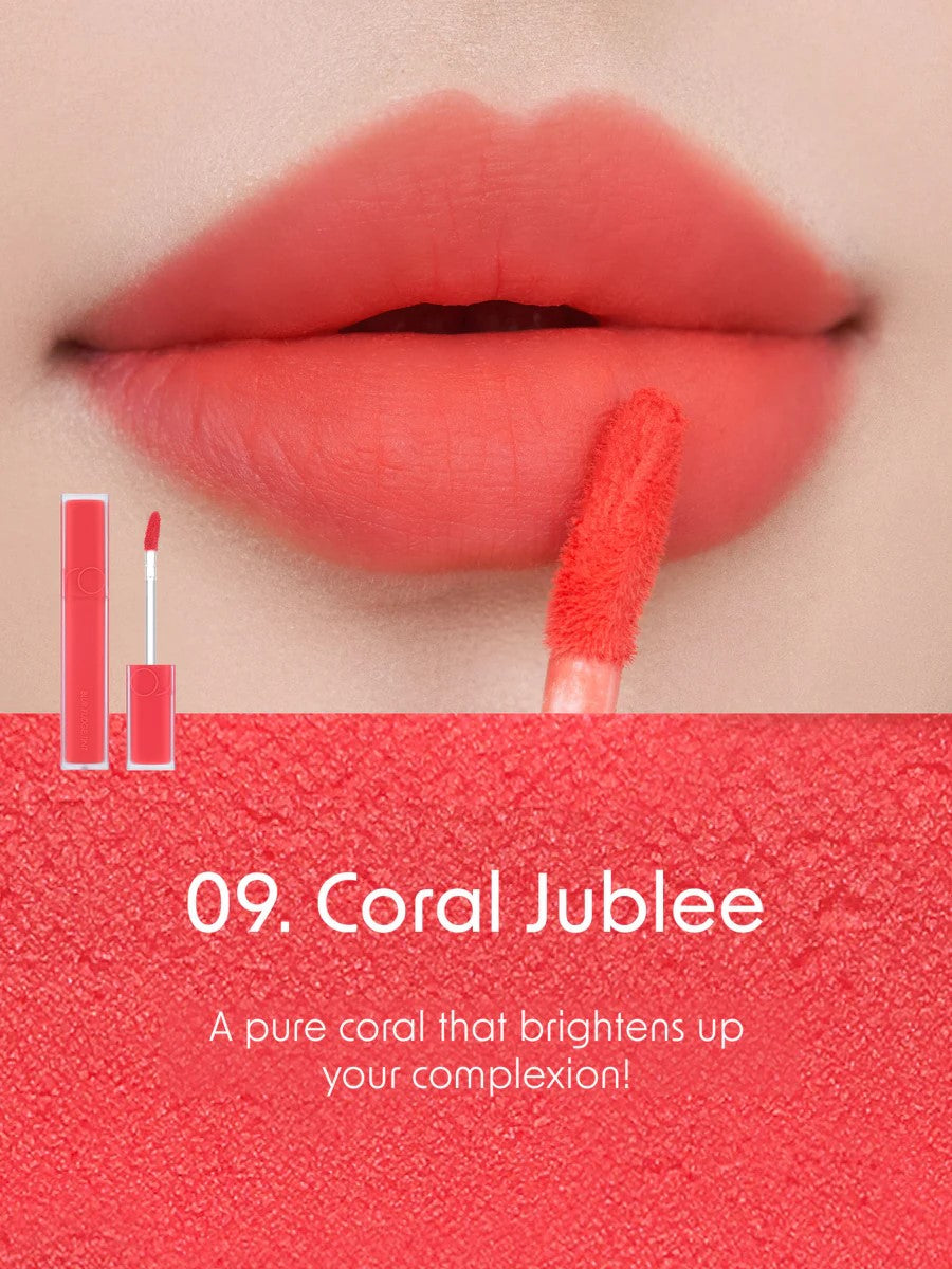 Close-up of lips wearing Romand Blur Fudge Tint in the shade Coral Jublee.