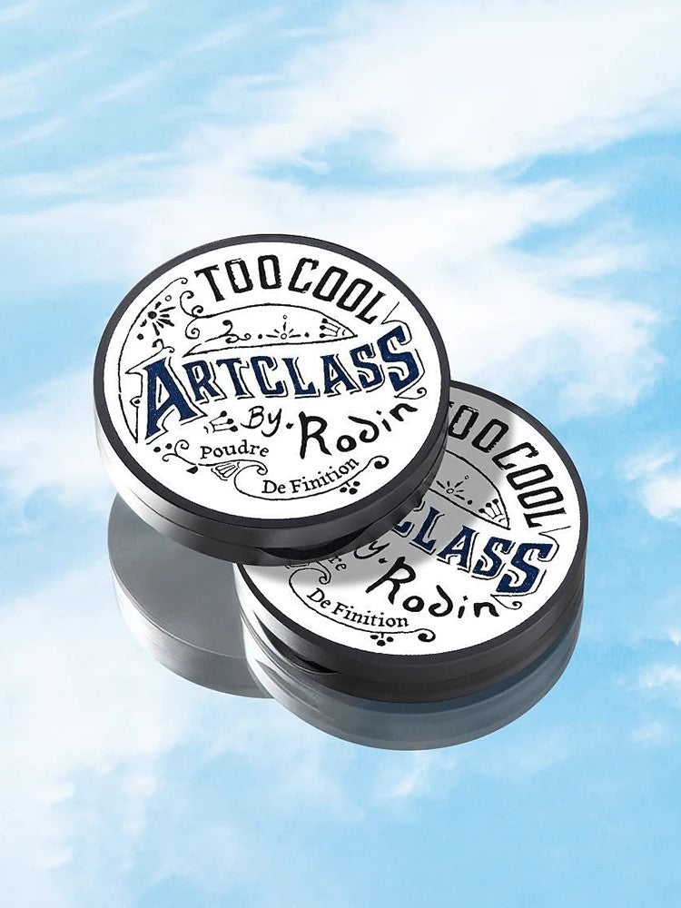 Two Too Cool for School Artclass By Rodin Finish Setting Pacts on a light blue background, highlighting their sleek product design and minimalist aesthetic.