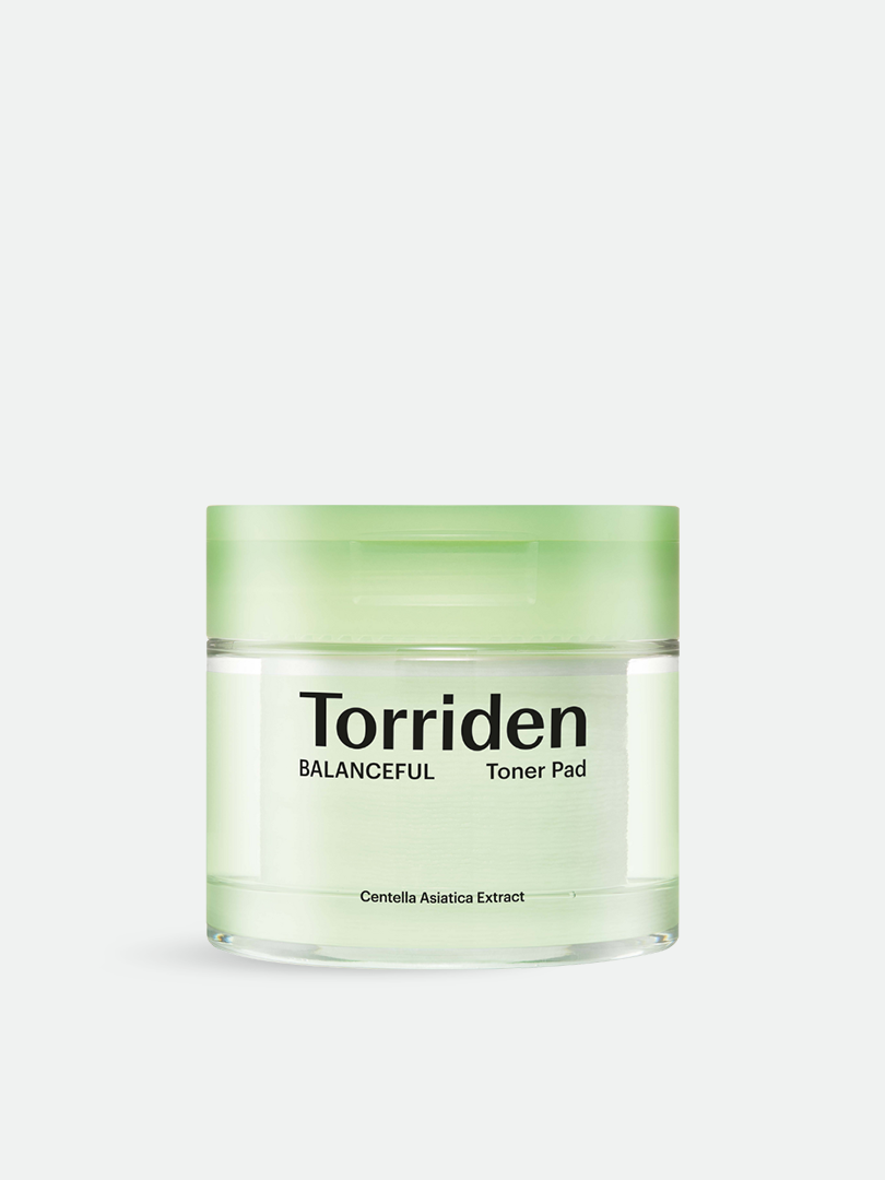 Torriden Balanceful Toner Pad in a clear jar with a green lid, featuring the brand name and a label highlighting 'Centella Asiatica Extract,' set against a neutral background.