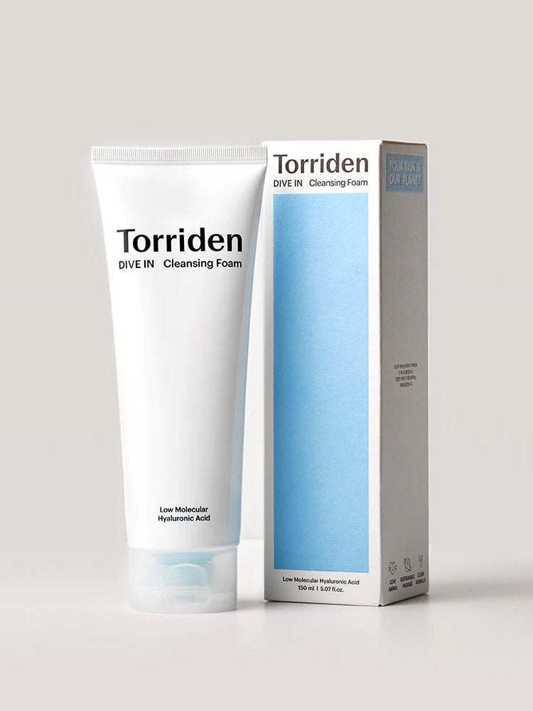 Tube of Torriden Dive In Cleansing Foam standing next to its packaging, labeled 'Low Molecular Hyaluronic Acid' for hydration.