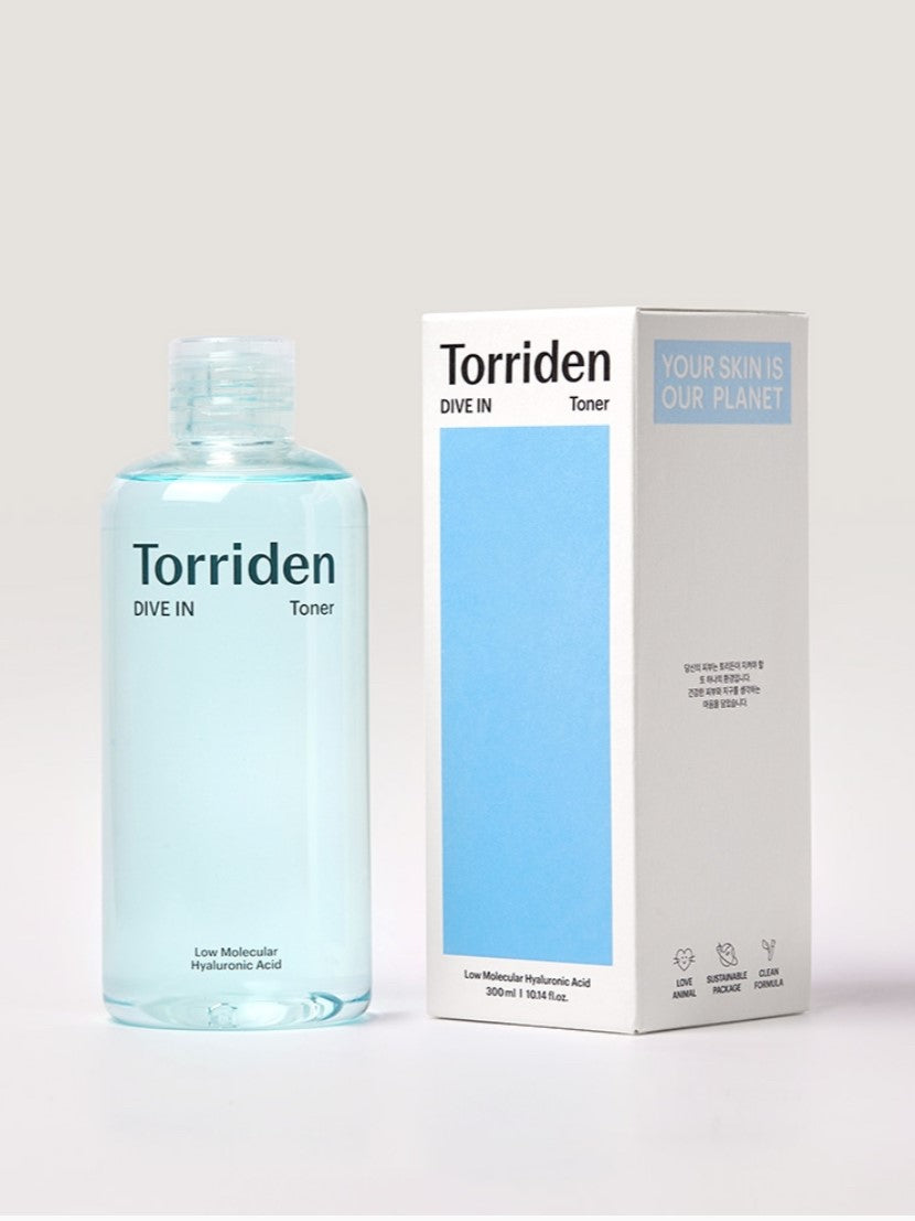 A bottle of Torriden Dive In Toner, a hydrating toner with low molecular hyaluronic acid, next to its eco-friendly packaging.