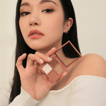 Model holding 3CE Mini Multi Eye Color Palette in Shade Casual Talk, highlighting its versatile application and everyday look.
