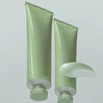 Two Abib Heartleaf Crème Calming Tubes with texture displayed in front, showcasing their soft sherbet consistency.