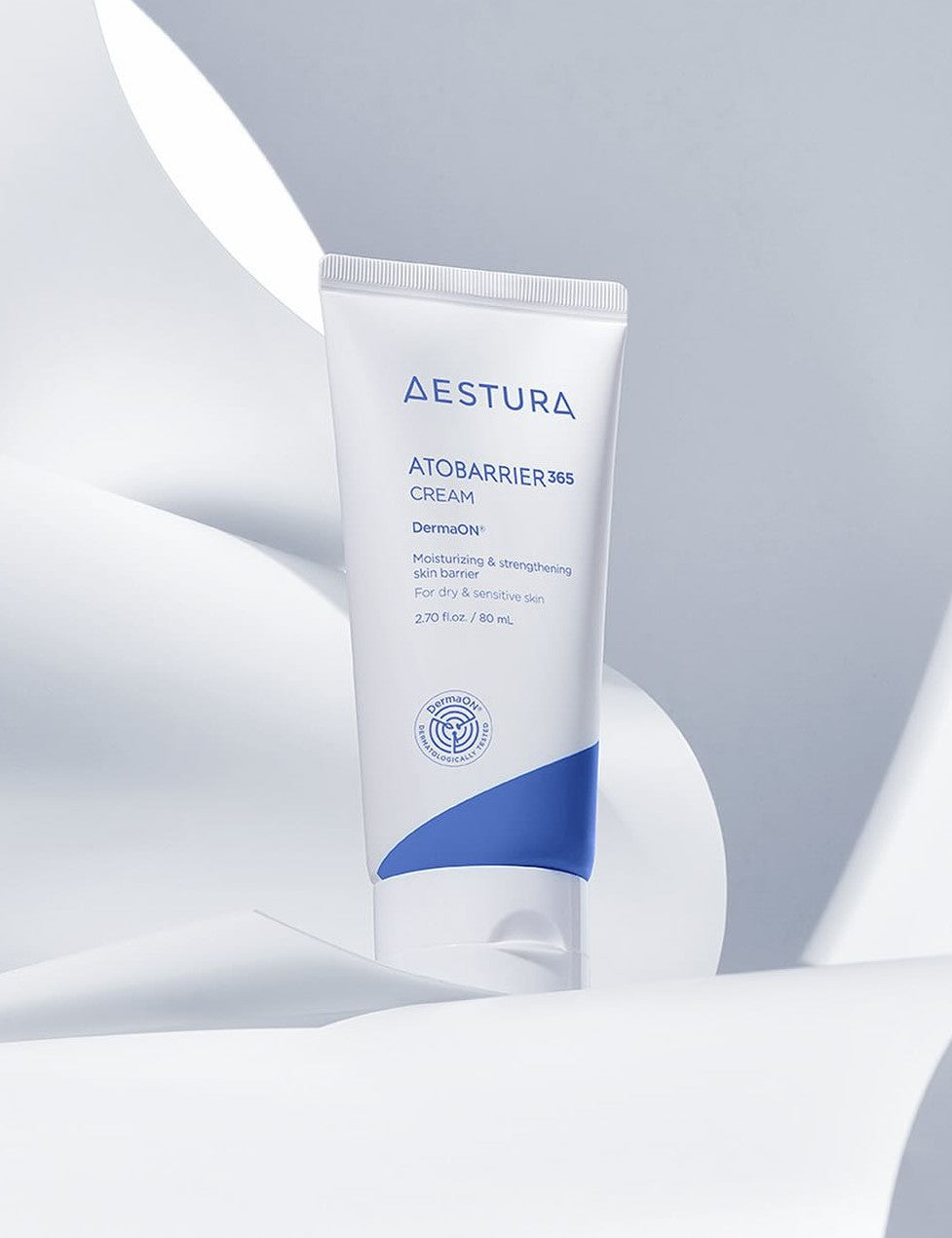 A tube of Aestura Atobarrier 365 Cream, designed to moisturize and strengthen dry, sensitive skin, set against a soft white background.