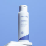 Aestura Atobarrier 365 Hydro Essence bottle promoting hydration for dry and weakened skin, displayed against a clear blue background.