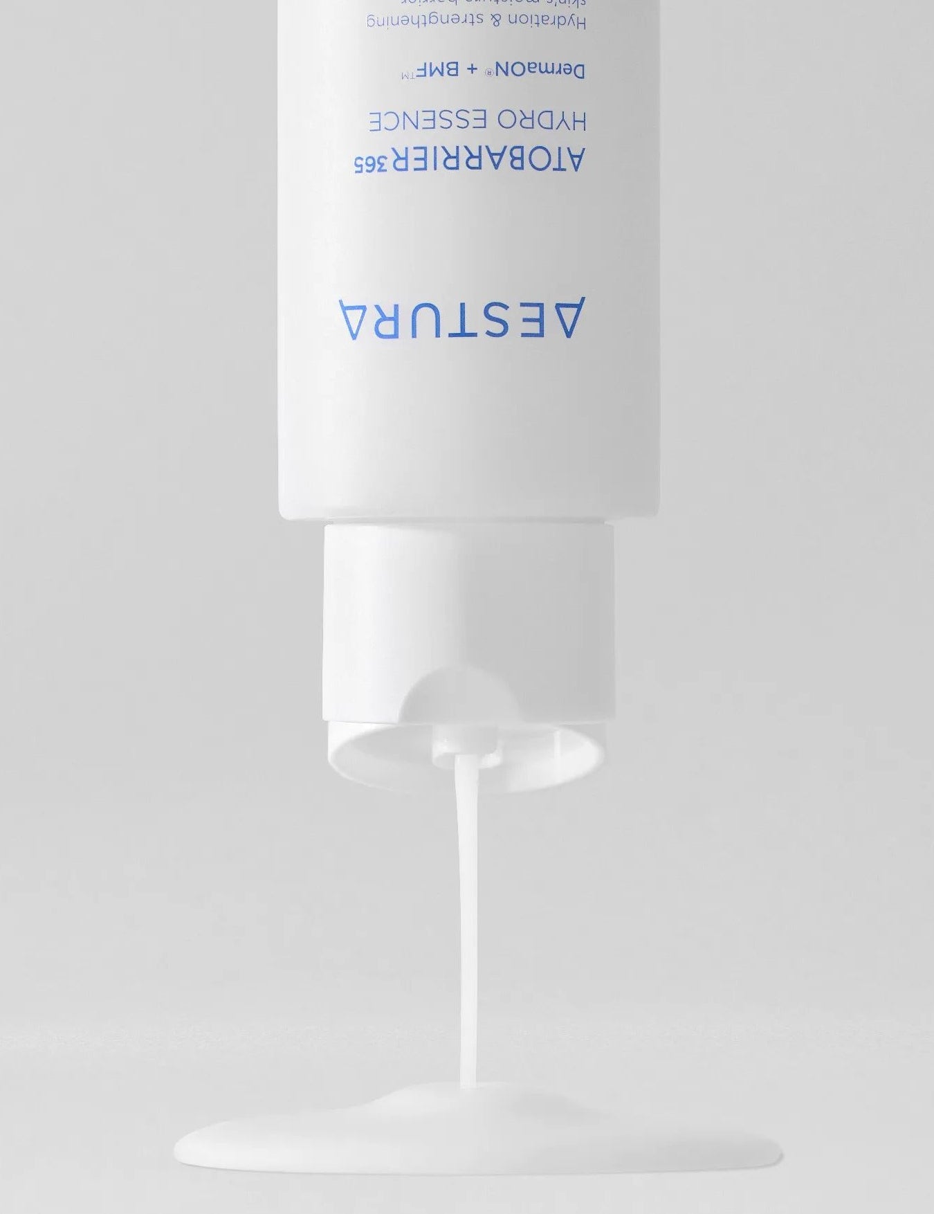 Aestura Atobarrier 365 Hydro Essence dispensing its creamy yet lightweight liquid onto a smooth surface.