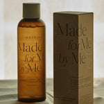 AXIS-Y Biome Comforting Infused Toner standing with its box on a soft fabric background.