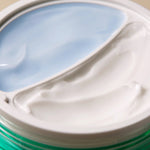 Close-up of Axis-Y Cera-Heart My Type Duo Cream texture, showing two sections: light blue gel on the left and thick white cream on the right.