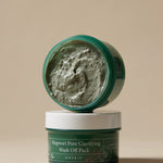 Two jars of Mugwort Pore Clarifying Wash Off Pack by AXIS-Y stacked, showcasing creamy green product inside the top jar.
