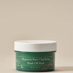 Green jar of Mugwort Pore Clarifying Wash Off Pack by AXIS-Y with minimalist design and vegan labeling, set against a neutral backdrop.