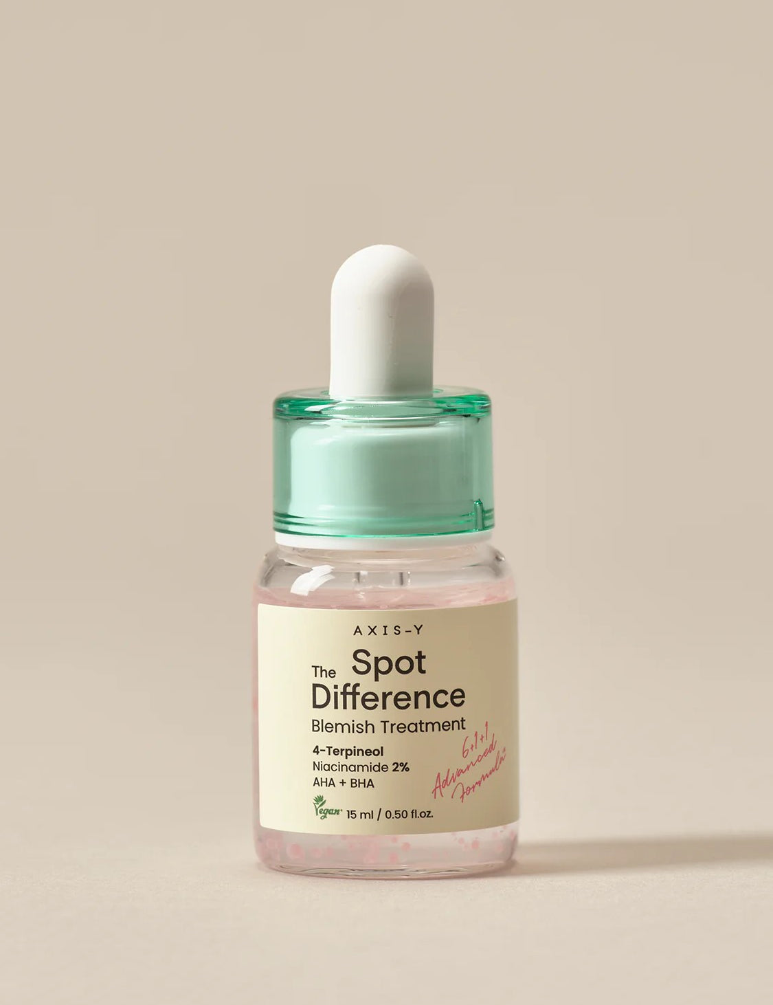 Small glass bottle of AXIS-Y Spot The Difference Blemish Treatment with a mint green dropper cap, featuring 4-Terpineol, Niacinamide 2%, AHA, and BHA for blemish care, on a neutral background.