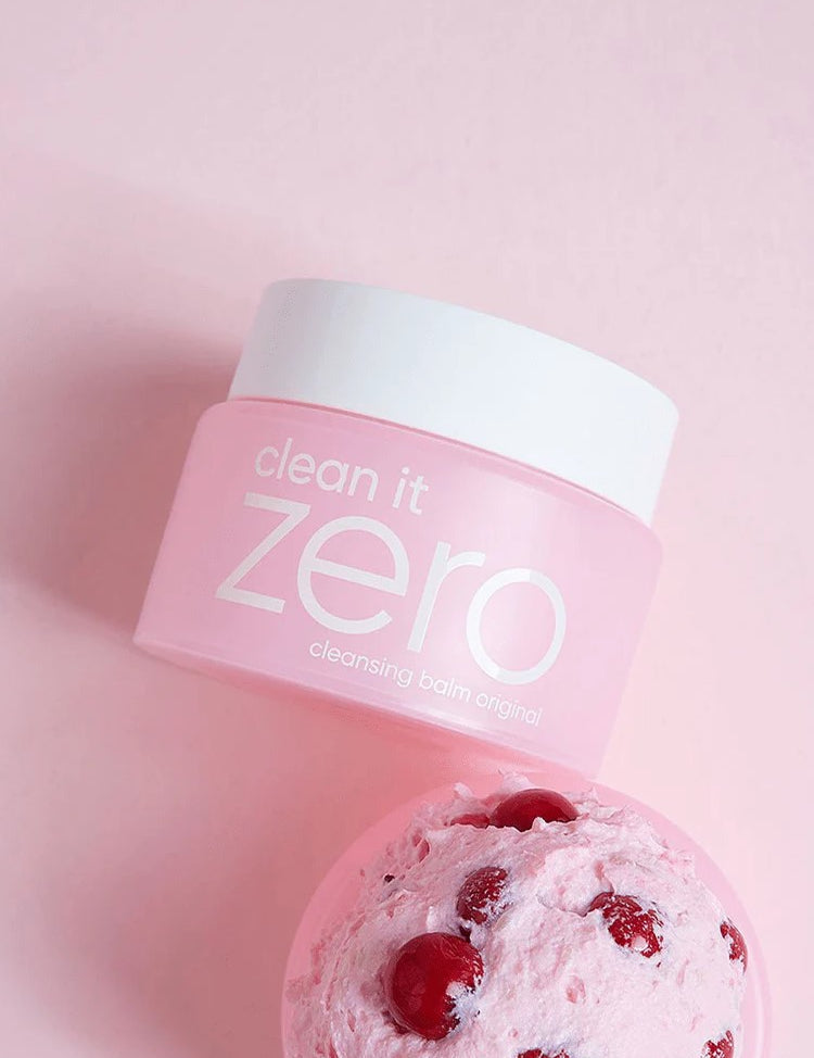 Banila Co Clean It Zero Cleansing Balm Original placed next to a scoop of acerola berry ice cream on a pink background, referencing its key ingredient Acerola Berry.