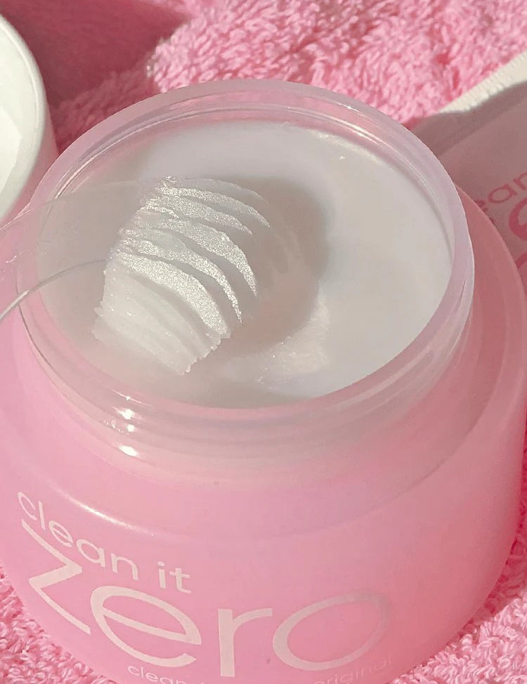 Close-up of Banila Co Clean It Zero Cleansing Balm Original jar with a textured scoop of balm inside, showing its smooth consistency.