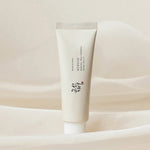Beauty of Joseon Relief Sun: Rice + Probiotics placed against a soft, textured background, highlighting its elegant design and dual benefits of nourishing skincare and sun protection.