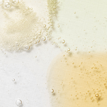 Close-up of bubbles in various shades floating on a white surface, showcasing the different textures of the Beauty of Joseon Serum collection.