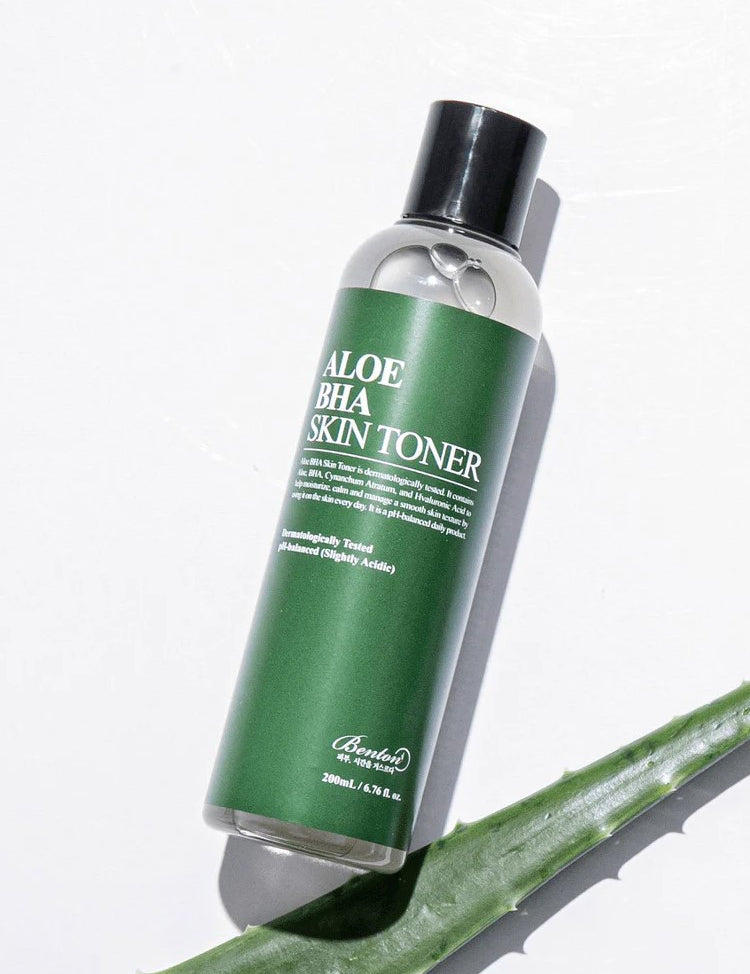 Benton Aloe BHA Skin Toner bottle with a green label on a white background, highlighting its soothing and skin-balancing properties.